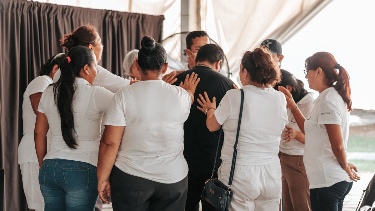 a group of people standing in a room